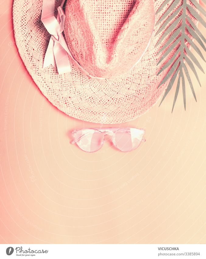 Summer straw hat wit sunglasses and palm leaves. Top view. Pastel color concept day art symbol pink top design vacation accessories colorful beauty beautiful