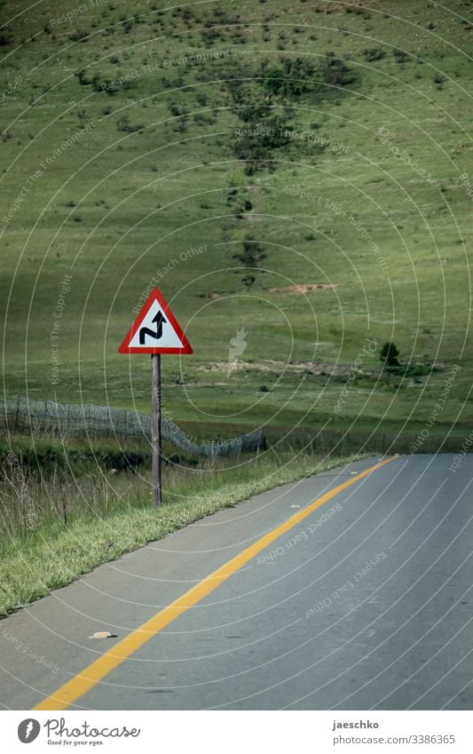 Curve warning sign at the roadside curves Warn Warning sign Road sign Right Left Left-hand traffic Hill overcome Wavy lines Right ahead Street Direct Arrow