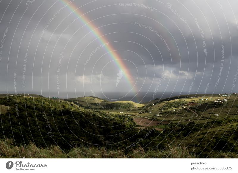 Rainbow over hills at the Wild Coast in South Africa Hill Hilly landscape coast Vacation & Travel Tourism Nature Light Sun Coffee Bay Weather Far-off places