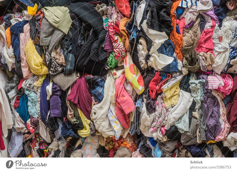 Bales of used textiles as background image Textiles Second-hand bale Second hand Many Textile industry recycling yard Recycling motley Clothing