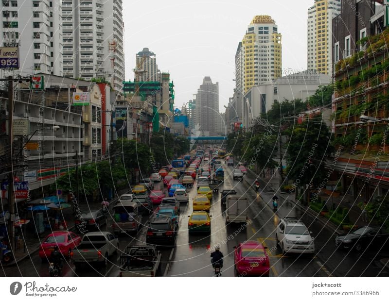 Traffic jam in Bangkok Street Traffic infrastructure Road traffic cars Smog High-rise Downtown Mobility Rush hour Bad weather gorge of houses stop and go hazy