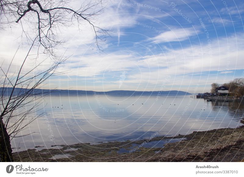 Blue sky with veil clouds and beautiful lake Sky cirrostratus clouds Lake beautiful view White clear vision