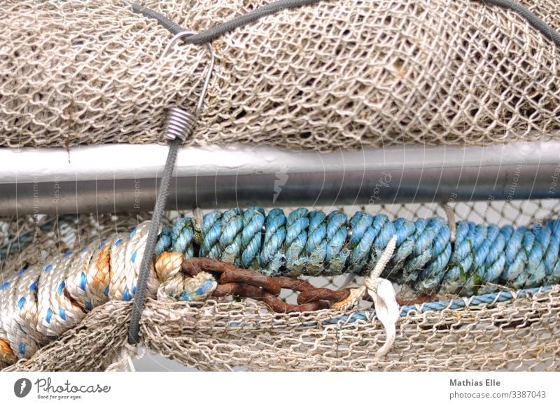 fishing net Fishing net Exterior shot Blue Day Deserted Detail String Rope Close-up Colour photo Structures and shapes Muddled Fishery Shallow depth of field