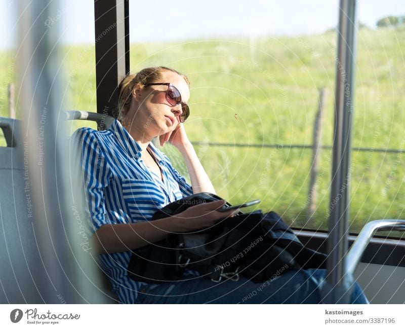 Portrait of tired woman sleeping on bus. passenger female nap commuter girl transportation inside journey people person tourism tourist beautiful work vacation