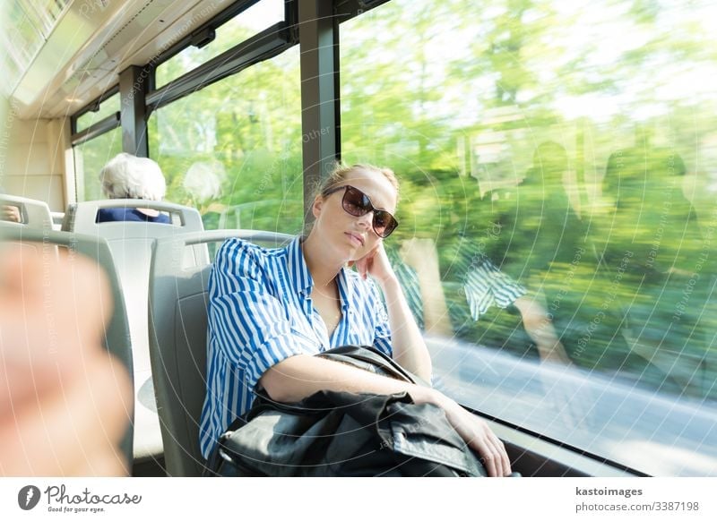 Portrait of tired woman sleeping on bus. passenger female nap commuter girl transportation inside journey people person tourism tourist beautiful work vacation