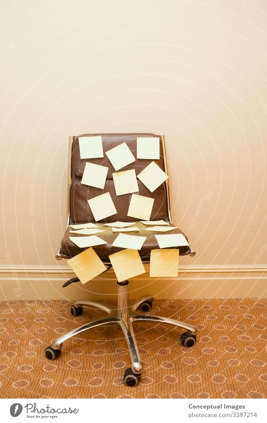 Post it notes on a chair post-it note brainstorming memo reminder to do schedule busy appointment office business paper strategy message teamwork sticky ideas