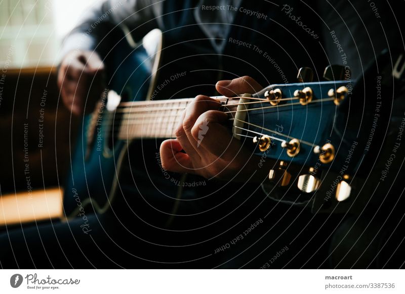 guitar Guitar Western guitar Guitarist Fretboard steel strings Blue hands Hand Man Grasp chords Close-up