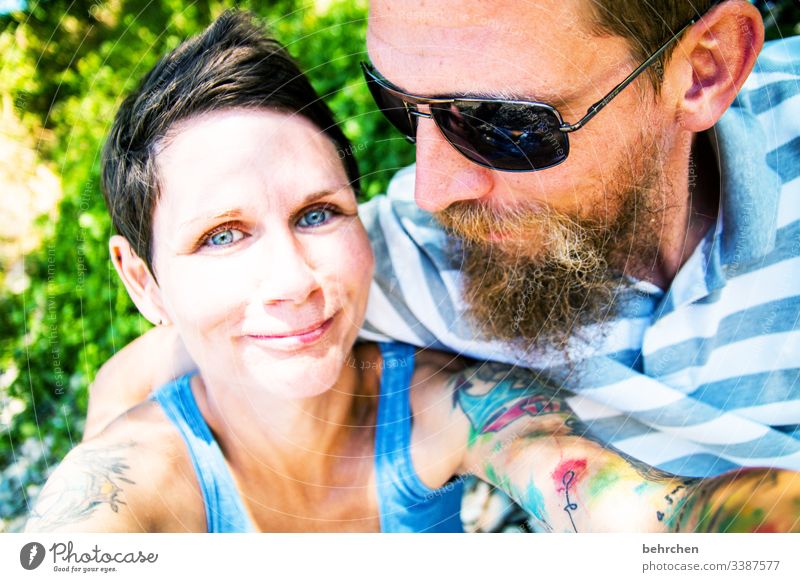 opposites | attraction portrait Blur Sunlight Contrast Light Day Tattoo Congenial Sunglasses Colour photo Exterior shot Love Together Contentment Happiness luck