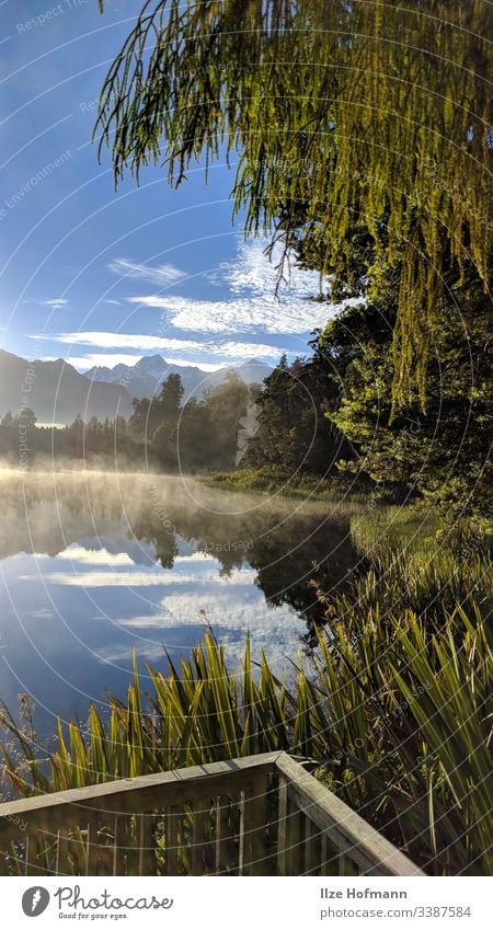 Matheson Lake Lake in New Zealand with reflecting surface and mountains in the background Lakeside Exterior shot Nature Colour photo Water Landscape Deserted