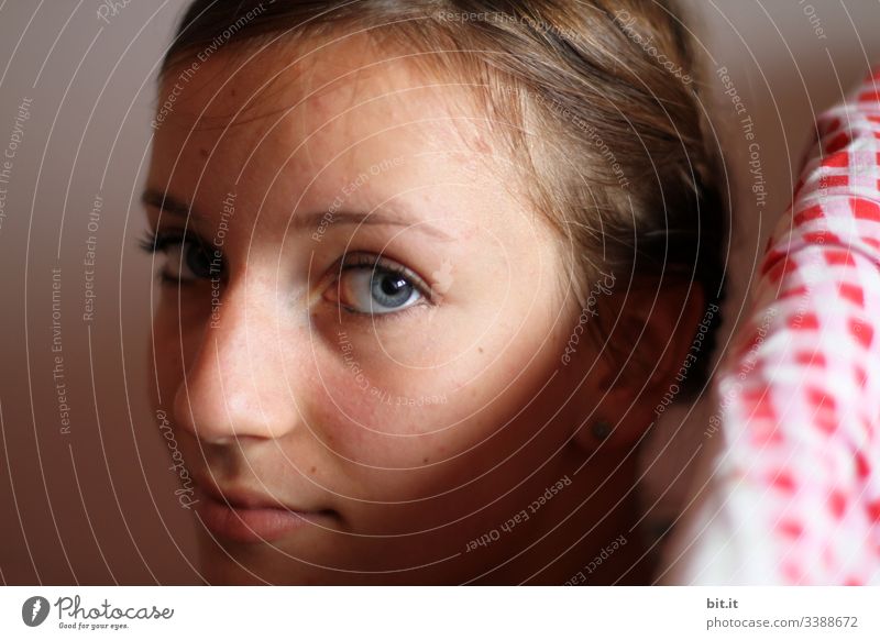 Young beautiful woman, at home in her room, looking into the camera, in the light of the sun. Woman Young woman girl Face Facial expression facial expression