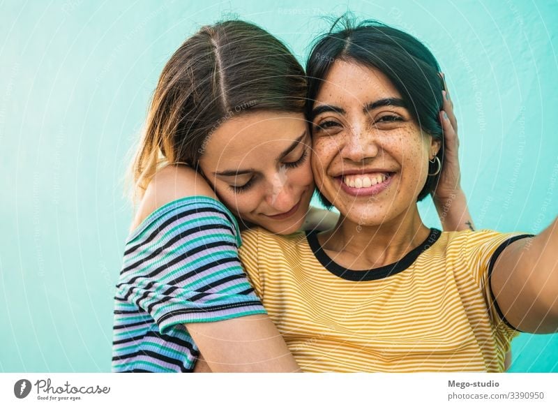 Lovely lesbian couple taking a selfie. female happy together two concept romance homosexual girl leisure hagging portrait girls picture laughing romantic pretty