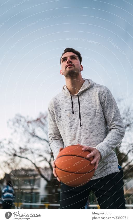 Young man playing basketball. training male young sport game player outdoor street hand athletic active boy playground club sporty workout leisure athlete fit