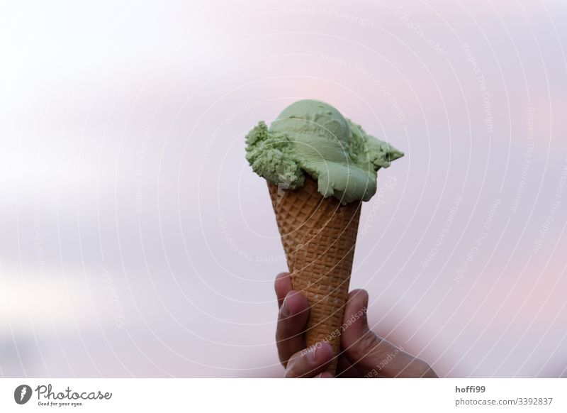 green woodruff ice cream in waffle in the sunset (was delicious) Ice Ice cream ball Woodruff Waffle Ice-cream cone Hand Colour photo Summer Nutrition Delicious