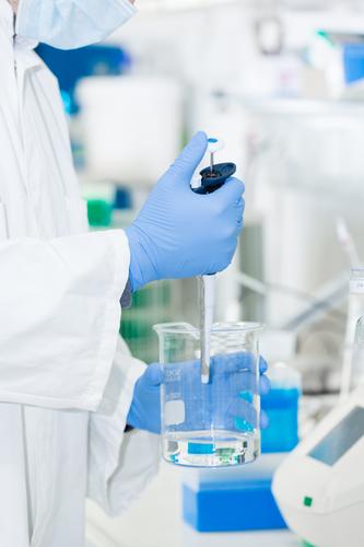 Person in the laboratory with face mask and gloves works with liquid person Mask Gloves Fluid Health care Hospital Doctor Surgeon Healthy Medication