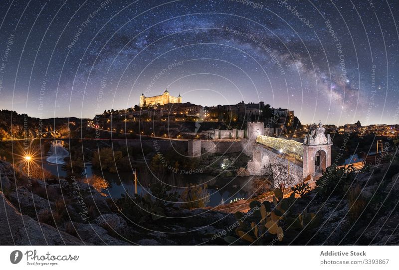 Wonderful landscape of Milky Way over ancient town at night milky way illuminated medieval city starry sky castle old cosmic galaxy constellation universe