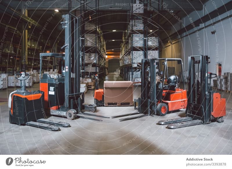 Modern equipment in big warehouse forklift truck storage machine shipment modern service logistic production cargo package automatic process appliance commerce