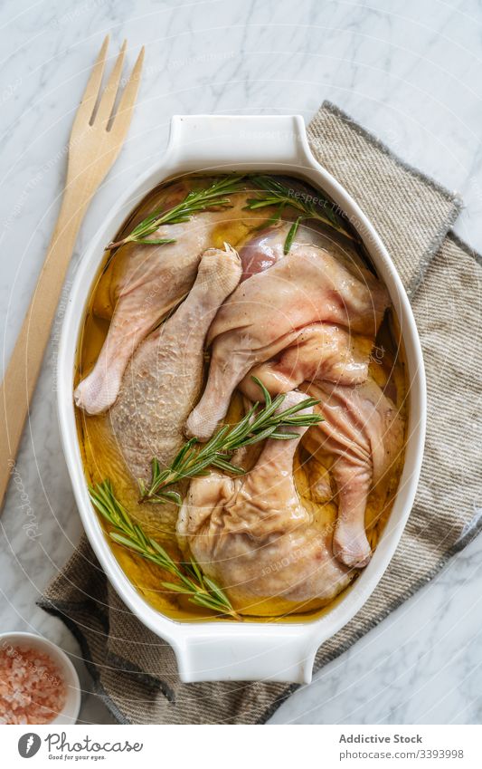 Uncooked marinated chicken legs in baking dish recipe bake food cooking raw ingredient kitchen meal dinner lunch preparation fresh cuisine culinary gastronomy