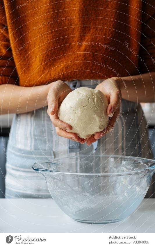 Woman with dough in hands standing at table making prepare food cooking recipe woman bake kitchen ingredient flour meal cuisine dish culinary gastronomy
