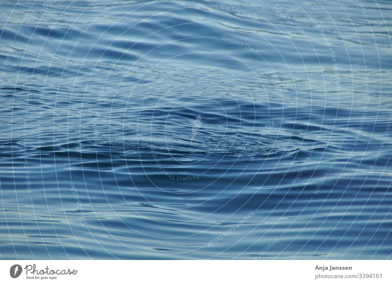 Just the blue ocean with little waves sea water deep nature background texture roundwaves circle