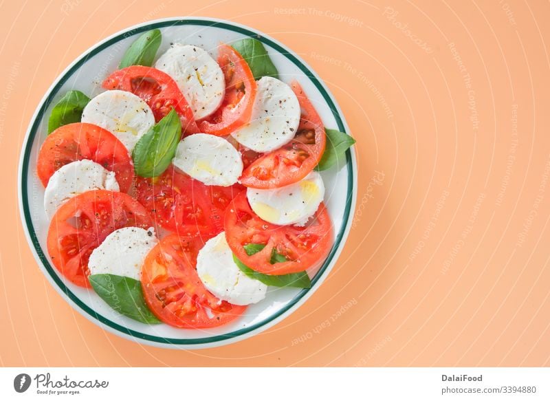 Caprese salad on brown background Basil Cheese complete Close-up Kitchen Diet Eating Food Fresh Healthy herbaceous Italian Italian Food Mediterranean