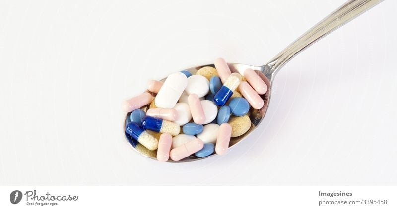 Medicine - capsules, tablets, pills on a spoon. capsule pill pile mix therapy medicine doctor flu antibiotic pharmacy medicine Medication encapsulate Spoon