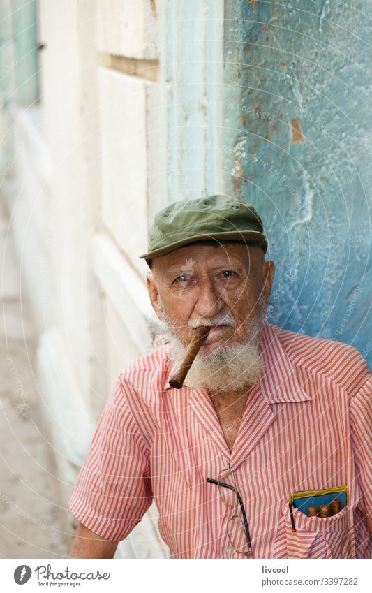 old grandfather smoking , havana - cuba ancient hat cigar cap bonnet smiling beard man people portrait grizzly la habana caribbean island street smile old man