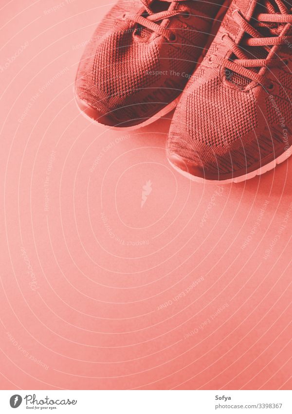Sport trainers on empty background. Red coral tone shoes color pink red gym sport sneakers walk workout bright exercise fitness lifestyle run power accessories