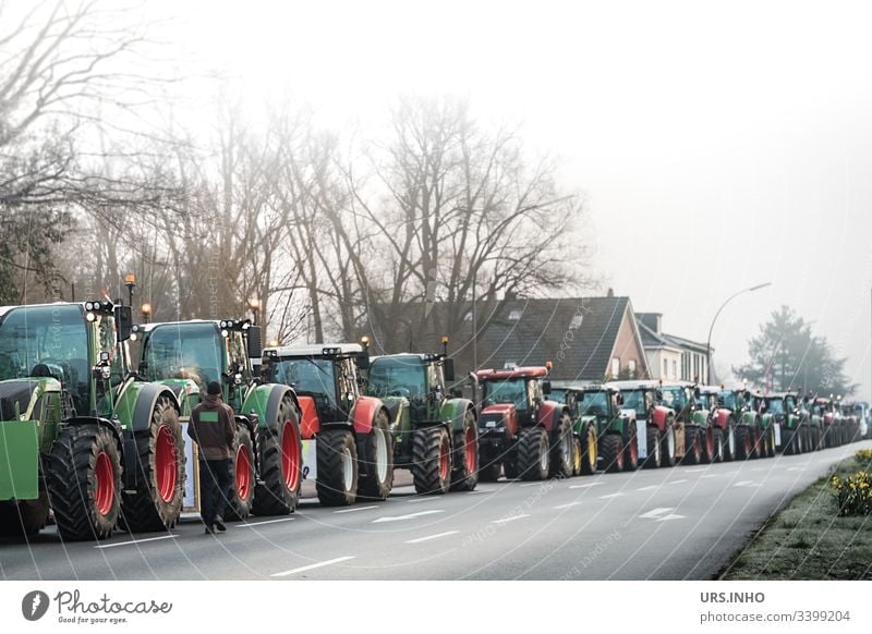 Convoy of tractors to the demo Tractors Agricultural Demo Demonstration Agriculture Protest of the farmers Rally Deep depth of field Street agricultural policy
