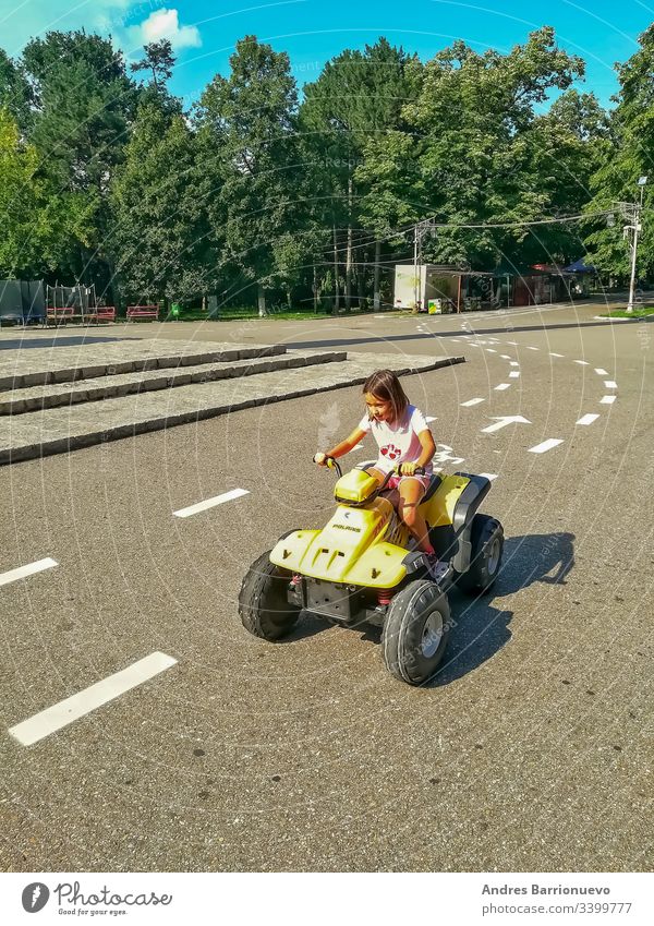 Little girl driving car bicycle embrace outdoor school active vacation happiness friendship people person bike young ride summer cheerful biker child happy