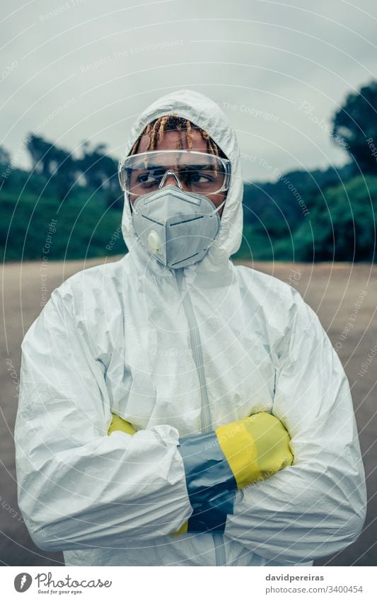 Man with bacteriological protection suit man worried protective mask covid-19 coronavirus epidemic safety glasses protection gloves equipment 2019-ncov pandemic