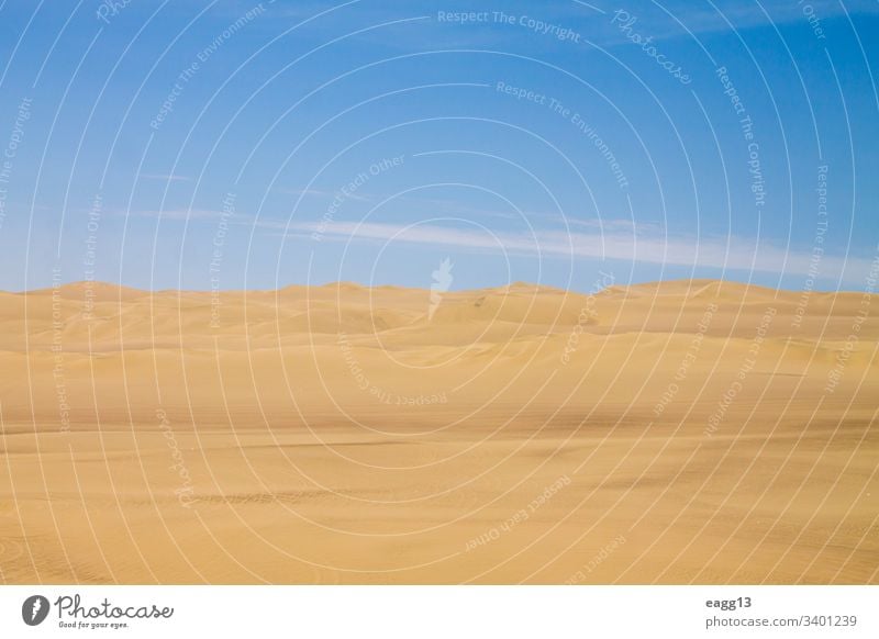 View of the dunes of Ica under the blue sky of Peru adventure arid background beautiful coastline dawn daylight desert drought dry dune grass extreme