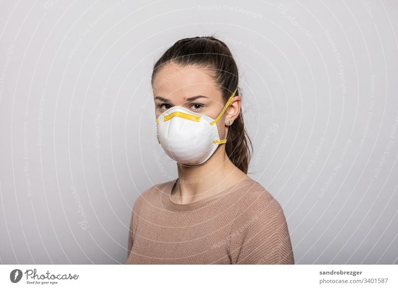 Girl with face mask coronavirus covid-19 Virus Illness pandemic Epidemic Mask guard sb./sth. disposable gloves hand protection Sterile Sick medicine Quarantine