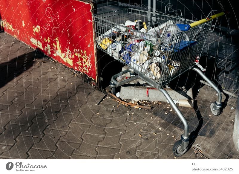 hamster purchase Shopping Trolley Supermarket Trash Trash container SHOPPING Shopping basket Consumption Colour photo Deserted Dirty Day Hoarding Exterior shot