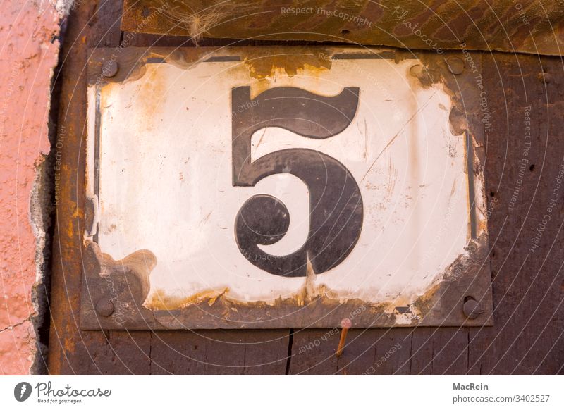 house number 5 House number Number plate digit five Enamel house wall Exterior shot Nail Rust nobody Copy Space