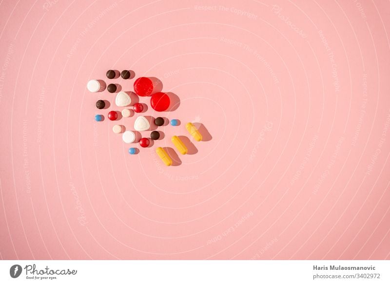 Colourful pill concept on pink background antibiotic Capsule care colourful Corona Design Medication Drug testing drugs Drug Concept Headache Healthy