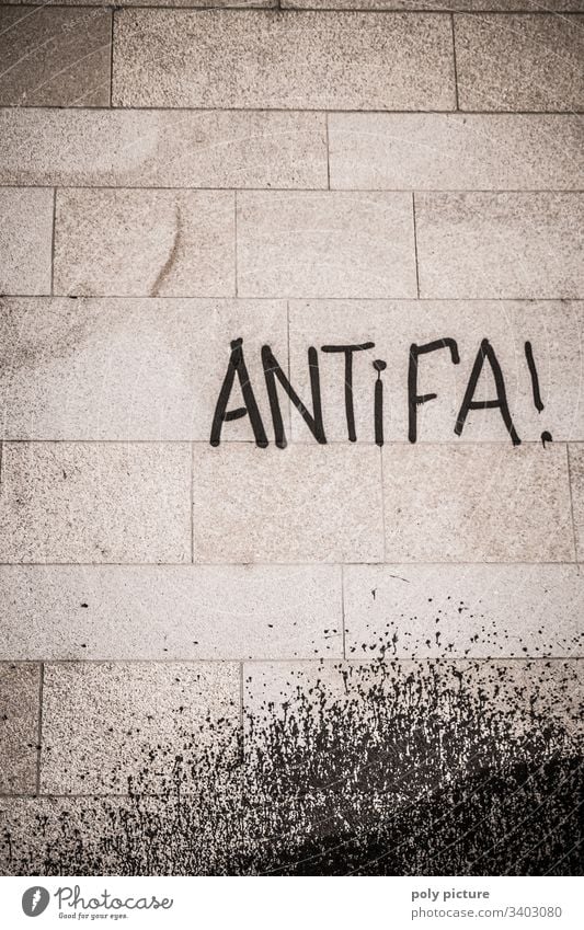 Antifa graffiti on a grey wall Shallow depth of field Motion blur Back-light AfD Alternative Dictatorship Force extremism left-wing extremism Ideology Bridge