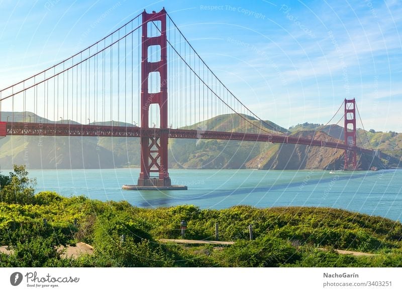 Golden Gate Bridge in San Francisco, California, Usa golden gate bridge san francisco sky usa blue ocean california bay historic green nature red grass travel