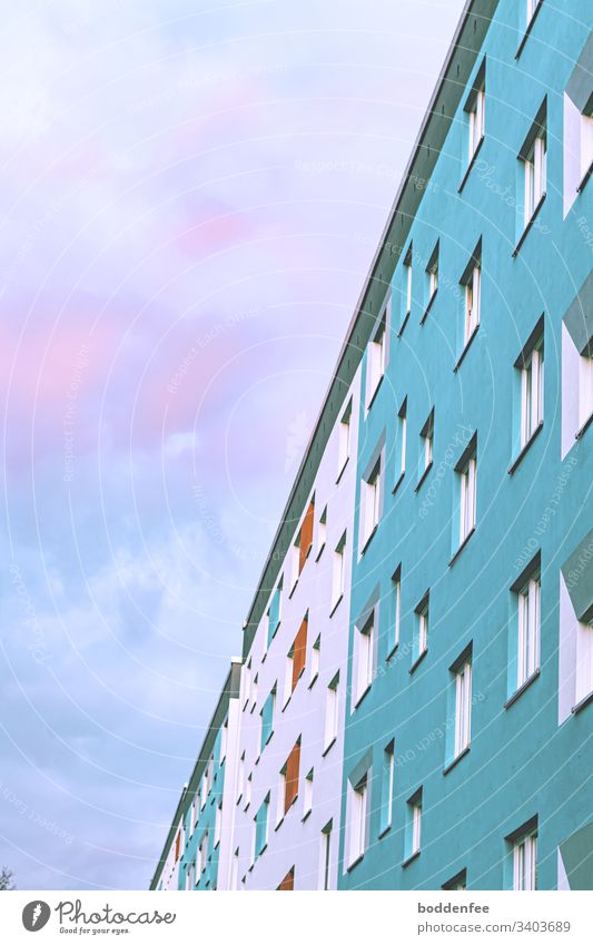 Facade prefabricated building against evening sky sunset Prefab construction Colouring of the prefabricated building Sky Sky blue High-rise Clouds Window Town