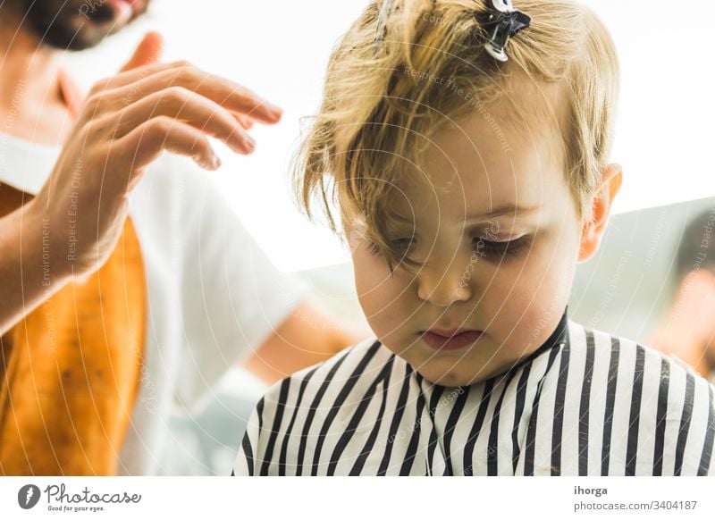 young boy having a hair cut - a Royalty Free Stock Photo from Photocase
