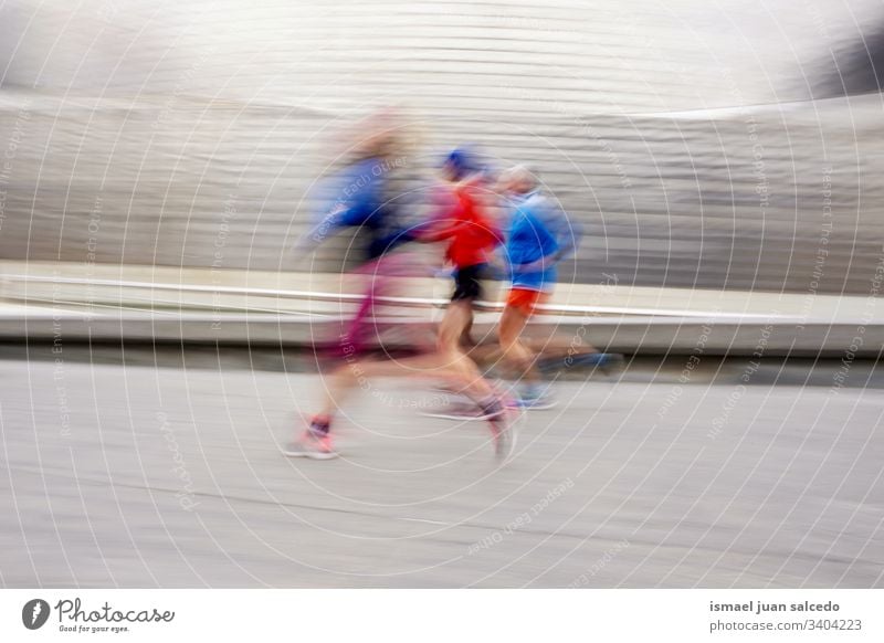 people running on the street in Bilbao city Spain, healthy life marathon runner jogging action fitness person human sport exercise speed fast blur blurred