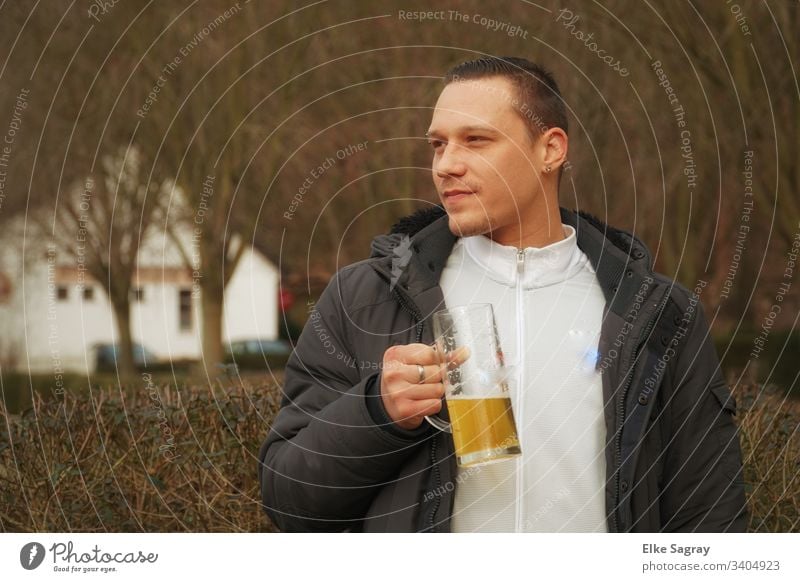 Young man in a standing beer garden Human being Youth (Young adults) Exterior shot One young adult man 18 - 30 years