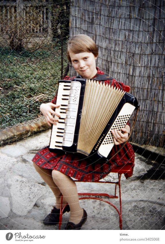 mood enhancer | accordion ensemble, middle Accordion Music Sit Chair stop entertainment Terrace Garden Dress Smiling Moody feminine Girl Blonde Short-haired out
