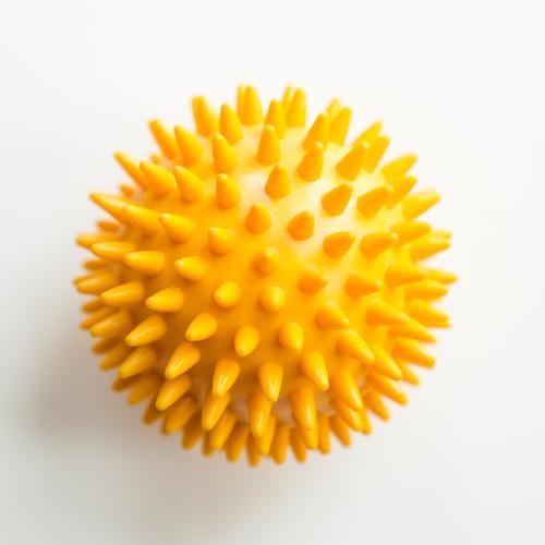 Yellow ball with spikes prickles Physiotherapy Therapy Illness Healthy Sports coronavirus Virus Round Hedgehog ball Ball