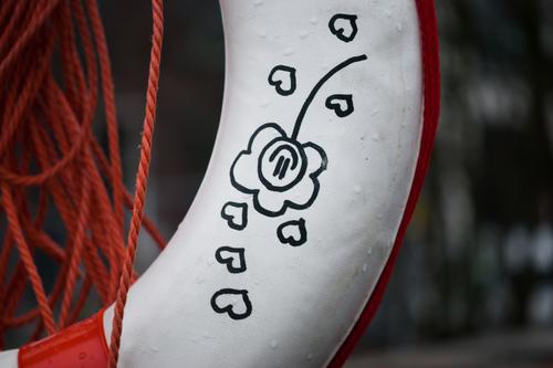 Lifebelt with leash, painted with flower and hearts Rescue Life belt Water wings Safety Detail Drown Protection Comic cuddle street art Sign Subculture