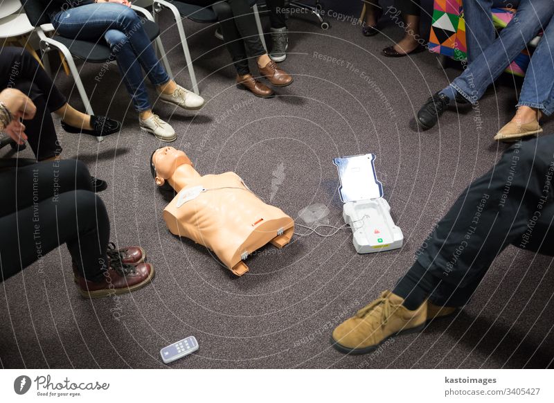 CPR course using automated external defibrillator device, AED. cpr aid first medical chest doll education emergency health procedure resuscitation life help