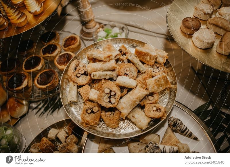 Ornamental plates with fresh pastry banquet table celebrate reception wedding food tasty sweet dessert snack cuisine tradition yummy delicious event festive