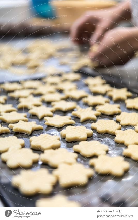 Crop baker making cookies on table cut bakery dough flour chef work cutter tool food kitchen pastry ingredient prepare sweet recipe cuisine biscuit shape fresh