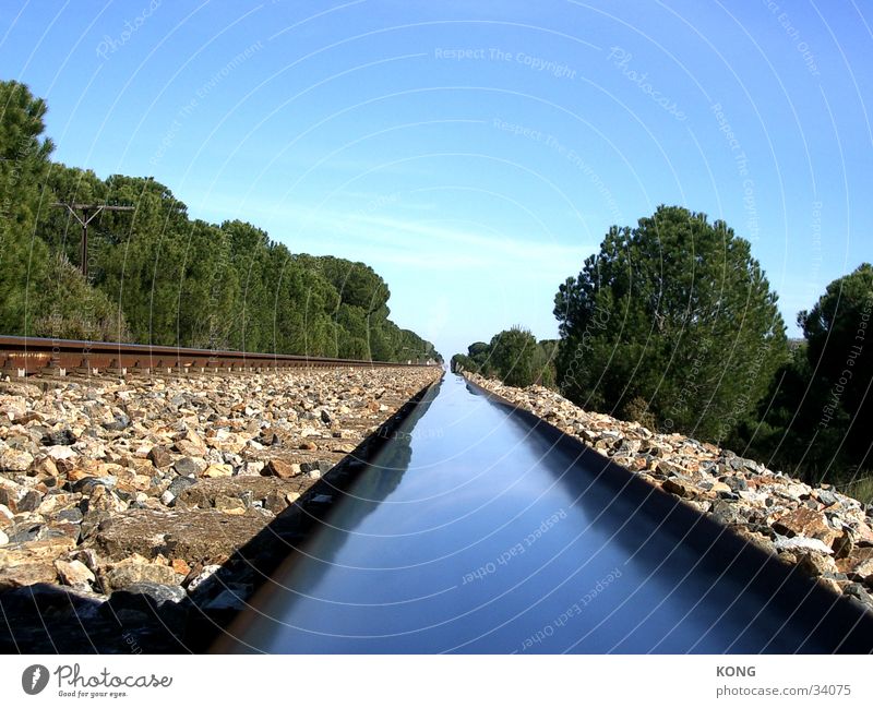 rail flow Railroad tracks Reflection Loneliness Horizon Spain Calm Transport Perspective Metal