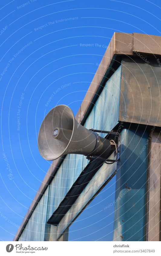 Loudspeaker on house wall in front of sky Megaphone Music announcement jail quiet Clang Noise Company db decibel sound sound level noise rest Disturbance