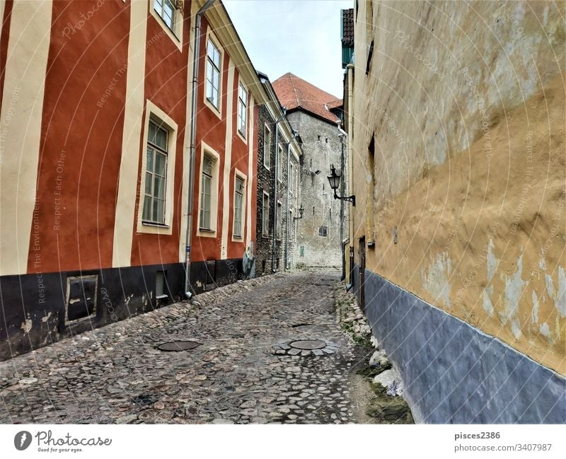 Beautiful old street in the city center of Tallinn town baltic european historic famous roof sightseeing tallinn medieval downtown evening travel wall landscape